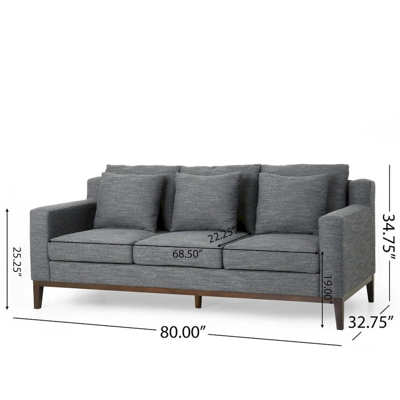 Un canapé trois places moderne avec coussins décoratifs.