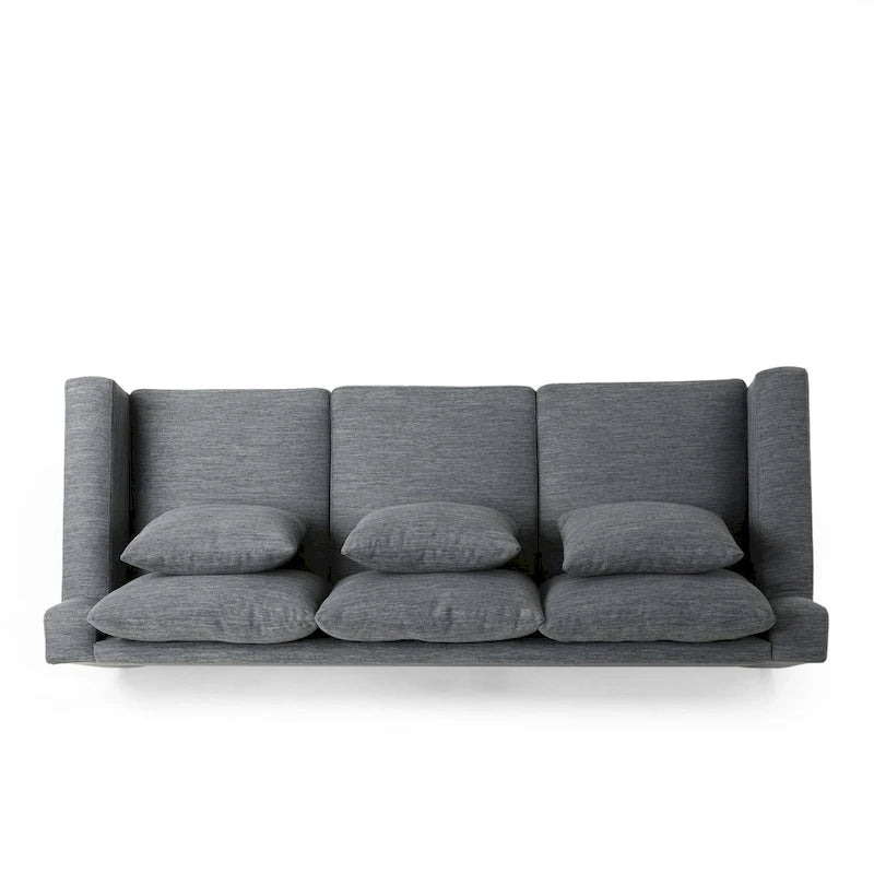 Un canapé trois places moderne avec coussins décoratifs.