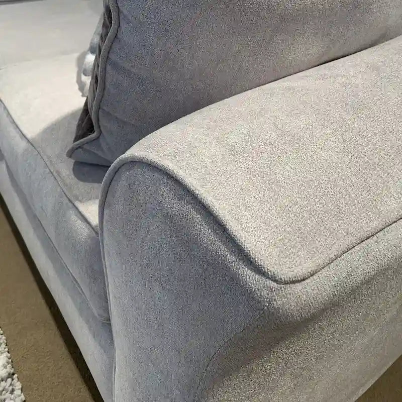 Causeuse en tissu à dossier moelleux